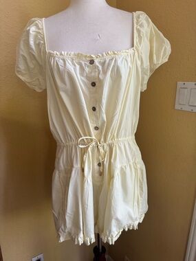 Free People sight for sore eyes butter yellow romper with ruffle detail. Large